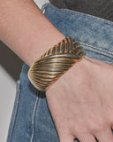 Bracelet rigide drapé