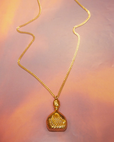 Pendentif parfum Ted Lapidus