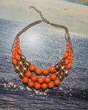 Collier perles oranges